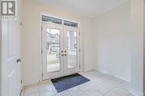 Caledon apartment for rent - A white door with a glass window is open.