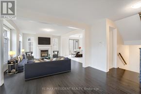Caledon apartment for rent - A spacious living room with a dark wood floor and white walls.