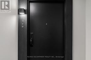Hamilton (Lakeshore) condo for rent - A black door with a handle and a lock.