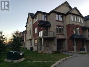 Hamilton (Meadowlands) apartment for rent - A large, multi-story residential building with a mix of brick and stone exterior.