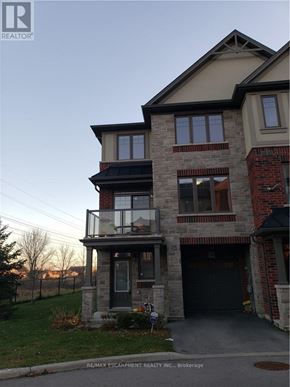 Hamilton (Meadowlands) apartment for rent - A house with a balcony and a garage door.