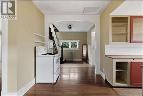 Port Coquitlam apartment for rent - A kitchen with a white dishwasher and wooden floors.