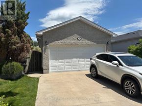 London East (East P) apartment for rent - A white car is parked in front of a garage.