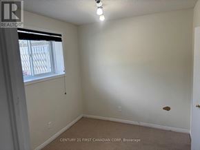London East (East P) apartment for rent - A room with a window and a door, with a sign that says "REALTOR".