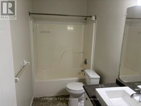 London East (East P) apartment for rent - A bathroom with a toilet, sink, and shower.