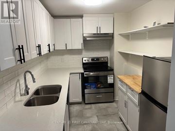 London East (East P) apartment for rent - A kitchen with a stainless steel dishwasher and refrigerator.