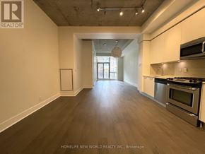 Toronto (Waterfront Communities) condo for rent - A spacious kitchen with a view of the city.