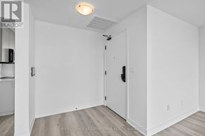 Burlington (Brant) condo for rent - A white room with a door and a light on the ceiling.