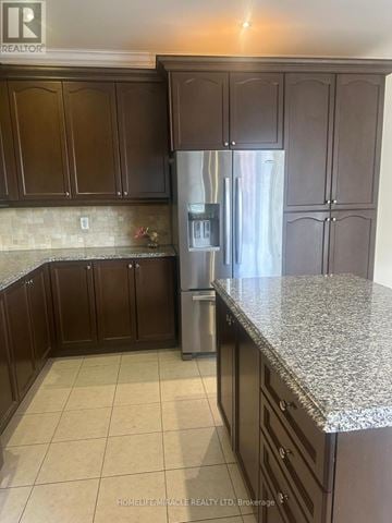 Brampton (Northwest Brampton) apartment for rent - A kitchen with brown cabinets and a granite countertop.