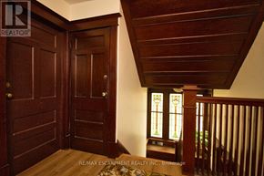 Hamilton (Blakeley) apartment for rent - A wooden door with a glass window is in the hallway.