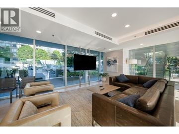 Burnaby apartment for rent - A living room with a brown couch and a flat screen TV.