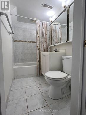 Toronto (L'amoreaux) apartment for rent - A white toilet in a bathroom with a glass shower door.