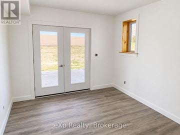 South Bruce duplex for rent - A room with a sliding door and a window.