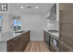 Burnaby apartment for rent - A modern kitchen with wooden cabinets and stainless steel appliances.