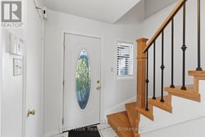 Oshawa (Pinecrest) apartment for rent - A stained glass window is on a white door.