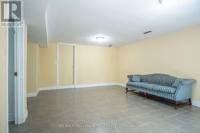 Toronto (Bedford Park-Nortown) apartment for rent - A living room with a couch and a door.