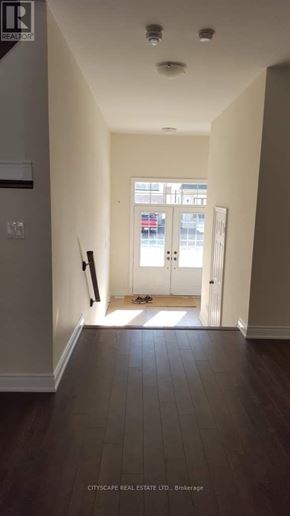 Niagara Falls (Brown) apartment for rent - A hallway with a door at the end.