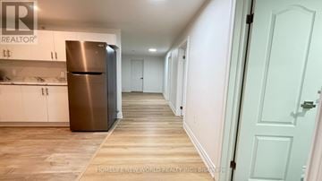 Toronto (Pleasant View) apartment for rent - A kitchen with a refrigerator and cabinets.
