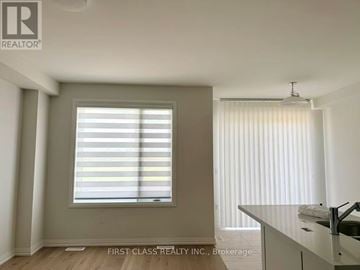 Richmond Hill townhouse for rent - A room with a window covered in blinds and a sink in the corner.