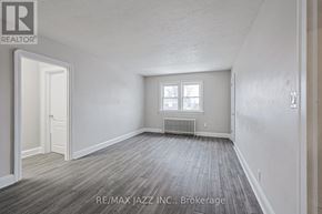 Oshawa (O'neill) multi-family for rent - A room with a window and a radiator is available for rent.