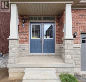 Brampton (Northwest Brampton) townhouse for rent - A blue door with a glass window and a sign on it.
