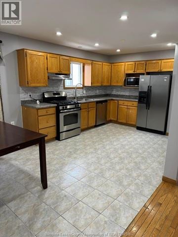 Windsor apartment for rent - A kitchen with wooden cabinets and a tile floor.