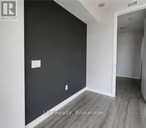 Toronto (Agincourt South-Malvern West) condo for rent - A room with a white door and a black wall.