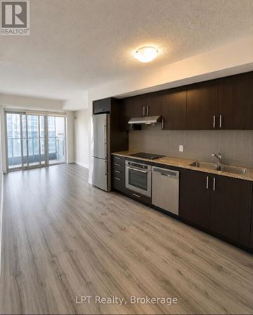 Toronto (Agincourt South-Malvern West) condo for rent - A kitchen with wooden cabinets and a stainless steel dishwasher.