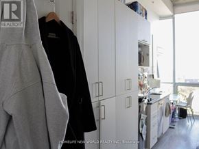 Oshawa (Samac) condo for rent - A grey hoodie hanging on a white door in a room.