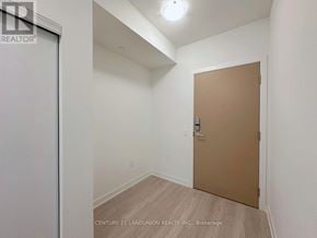 Toronto (Banbury-Don Mills) condo for rent - A room with a brown door and a white wall.
