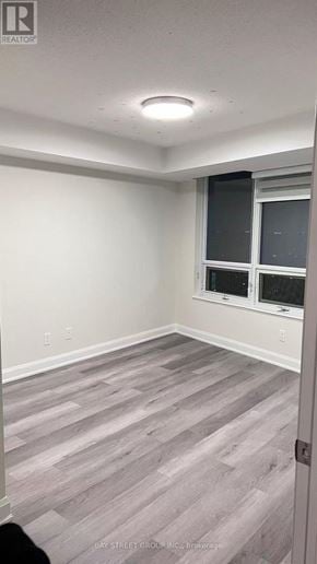 Toronto (Newtonbrook West) condo for rent - A room with a window and a wooden floor.