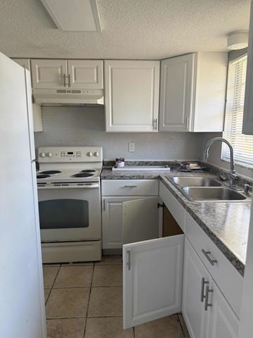 Clearwater apartment for rent - A kitchen with white cabinets and appliances.