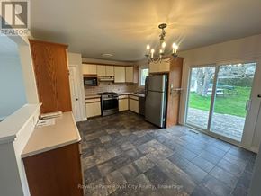 Guelph (Victoria North) apartment for rent - A kitchen with a refrigerator, oven, and microwave.