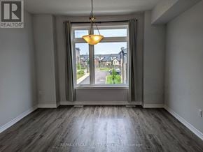 Hamilton (Mountview) townhouse for rent - A room with a large window and a view of a street.