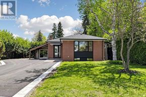 Aurora (Aurora Highlands) apartment for rent - A house with a brick facade and a large front yard.