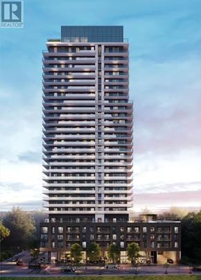 Burlington (Brant) condo for rent - A tall residential building with a glass top and a smaller building in front of it.