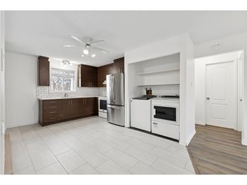 Gatineau (Gatineau) condo for rent - A kitchen with white appliances and brown cabinin