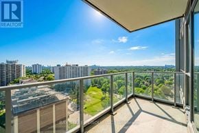 Toronto (Henry Farm) condo for rent - A balcony with a view of the cityscape and greenery.