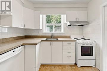 Toronto (Newtonbrook West) apartment for rent - A kitchen with white cabinets and appliances.