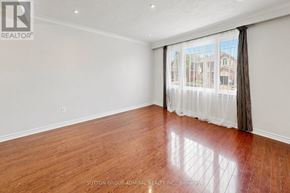 Toronto (Newtonbrook West) apartment for rent - A room with wooden flooring and a window with curtains.