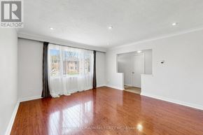 Toronto (Newtonbrook West) apartment for rent - A room with wooden floors and white walls, with a sliding glass door leading to a balcony.