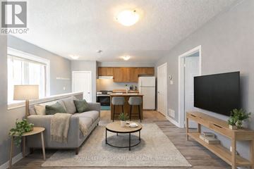 Markham (Cornell) apartment for rent - A living room with a grey couch, a coffee table, and a flat screen TV.