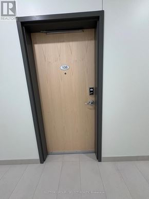 London East (East K) condo for rent - A wooden door with the number 106 on it.
