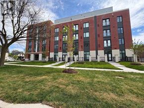 London East (East K) condo for rent - A modern red brick building with a tree in front.