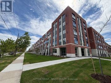 London East (East K) condo for rent - A large red brick building with a walkway in front of it.