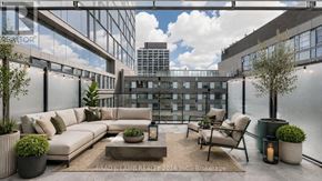 Toronto (Moss Park) condo for rent - A modern outdoor seating area with a view of the city.