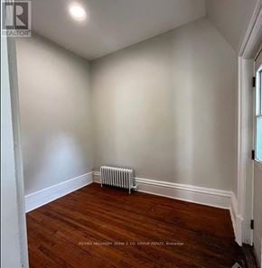 Brockville multi-family for rent - A room with a white wall and a radiator on the floor.