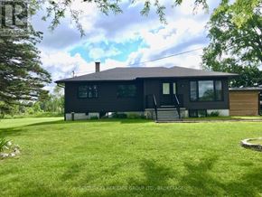 Frontenac (Frontenac Centre) apartment for rent - A black house with a white roof and a green lawn in front.
