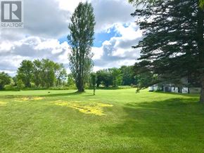 Frontenac (Frontenac Centre) apartment for rent - A green field with trees and a building in the background.