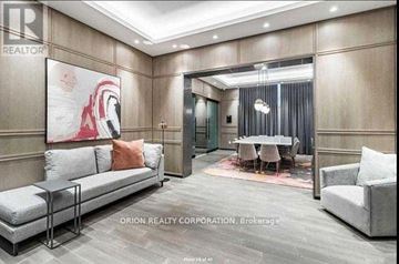 Toronto (Islington-City Centre West) condo for rent - A living room with a grey sofa and a painting on the wall.
